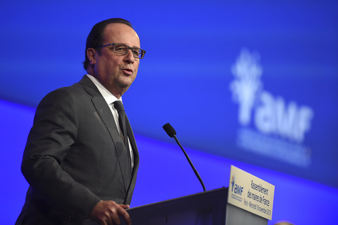 French President Francois Hollande delivers a speech during a meeting with French mayors in Paris Wednesday Nov. 18 2015. French President Francois Hollande says France is'at war against terrorism by the Islamic State group. (Stephane de Sakutin Pool