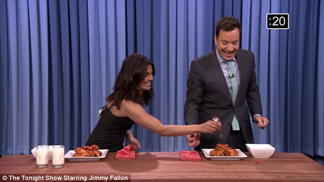 Eye-watering The beauty challenged Jimmy to a competition eating'nuclear hot chicken wings- and added extra Tabasco