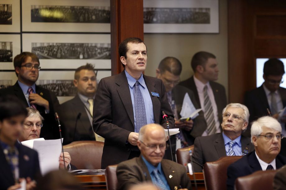 Democratic State Rep. Ben Chipman D-Portland submits an order to impeach Gov Paul LePage Thursday Jan. 14 2016 in the House chamber at the State House in Augusta Maine. The proposal aims to punish the Republican governor for using influence to pre