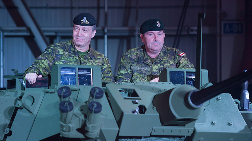 Two soldiers are shown in the new upgraded Light Armoured Vehicle as it's unveiled at a news conference at a General Dynamics facility in London Ont. on Thursday